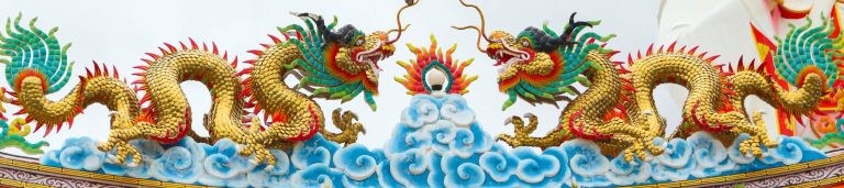 Artwork of two traditional Chinese dragons facing each other.