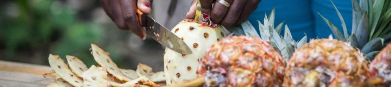 Image of a pineapple being cut.