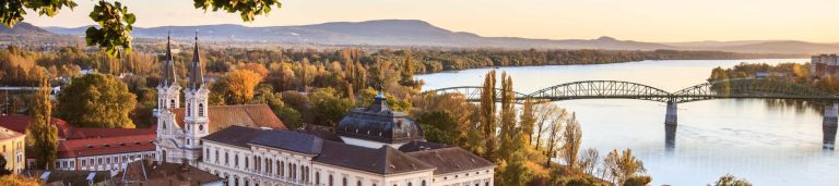 A top view of buildings overlooking a body of water in Hungary.