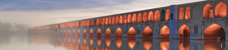 Image of a well light bridge over a body of water in Iran.