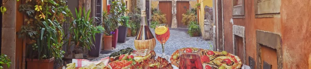 A table set up with wine and some traditional Italian food